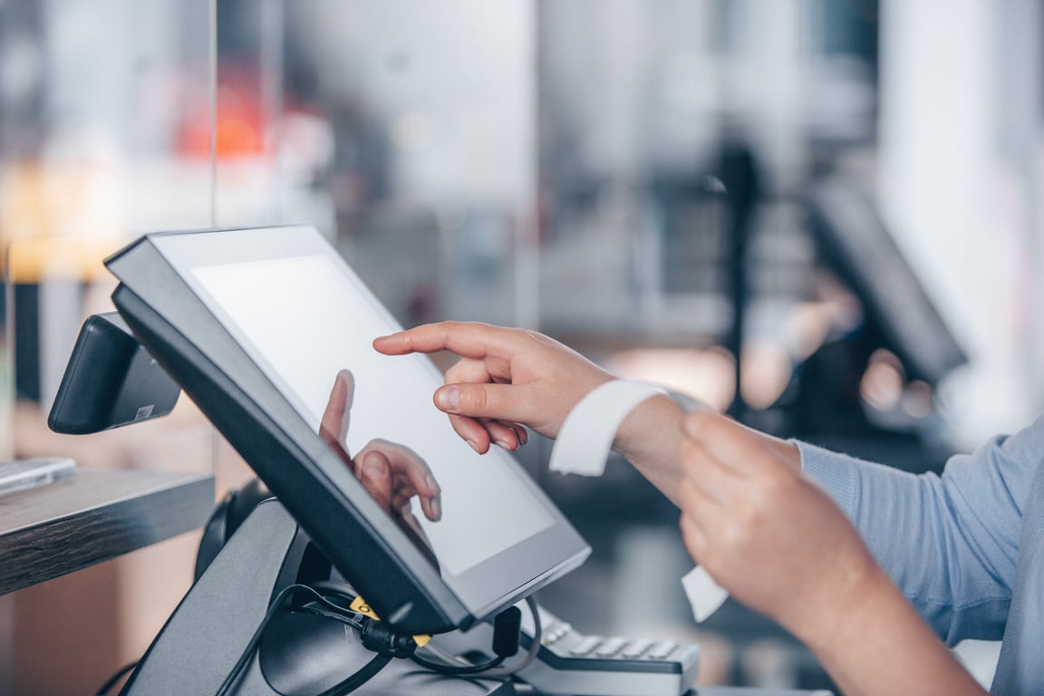 Cashier Using the Point of Sale System